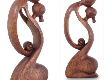 A Mother s Kiss Suar Wood Sculpture on Sale